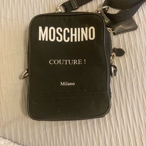 Moschino black fabric cross body bag.